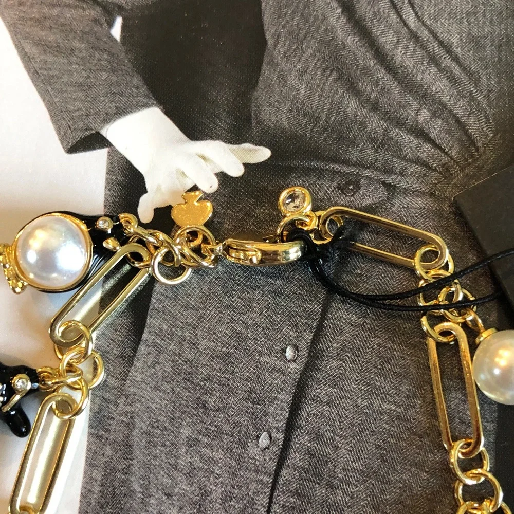 Authentic kate spade NWT Gold Charm Bracelet with Pearls and Black Penguins